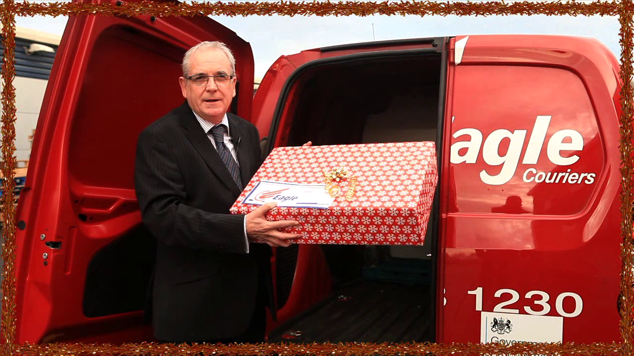 Jerry co-director of Eagle Couriers, a Courier Scotland company, putting present in van