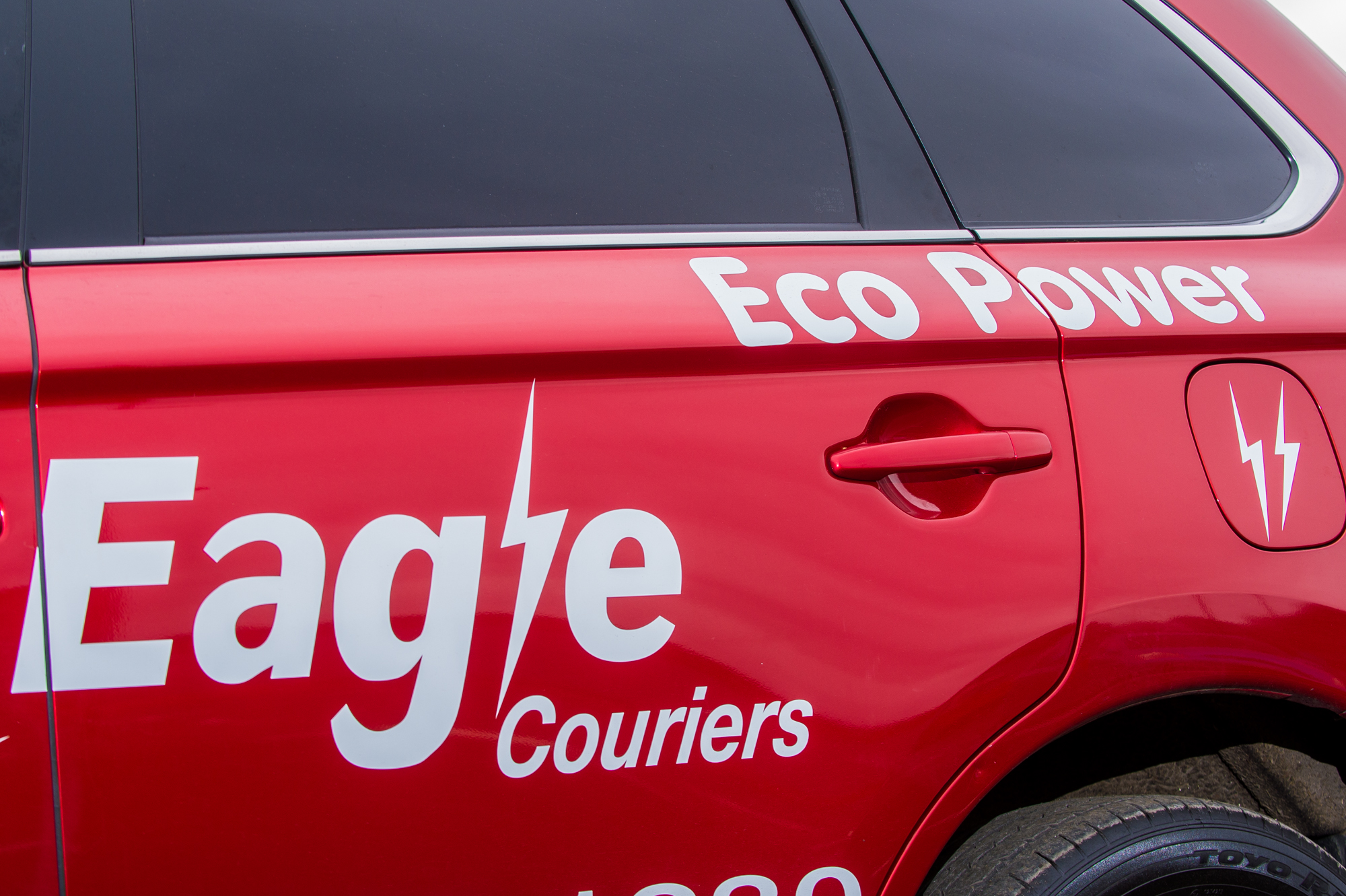 Mitsubishi Hybid EV operated by Eagle Couriers in Scotland